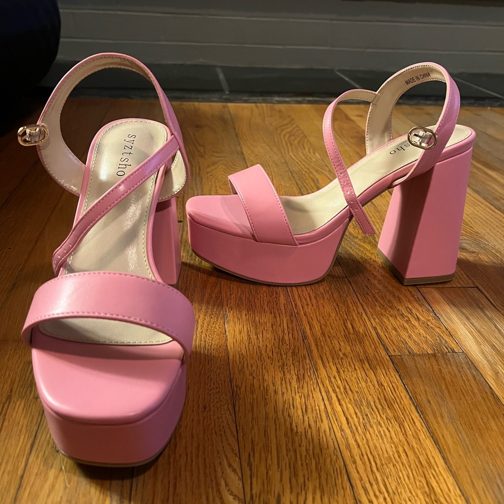 Pink platform heels. Size 9. Never worn.